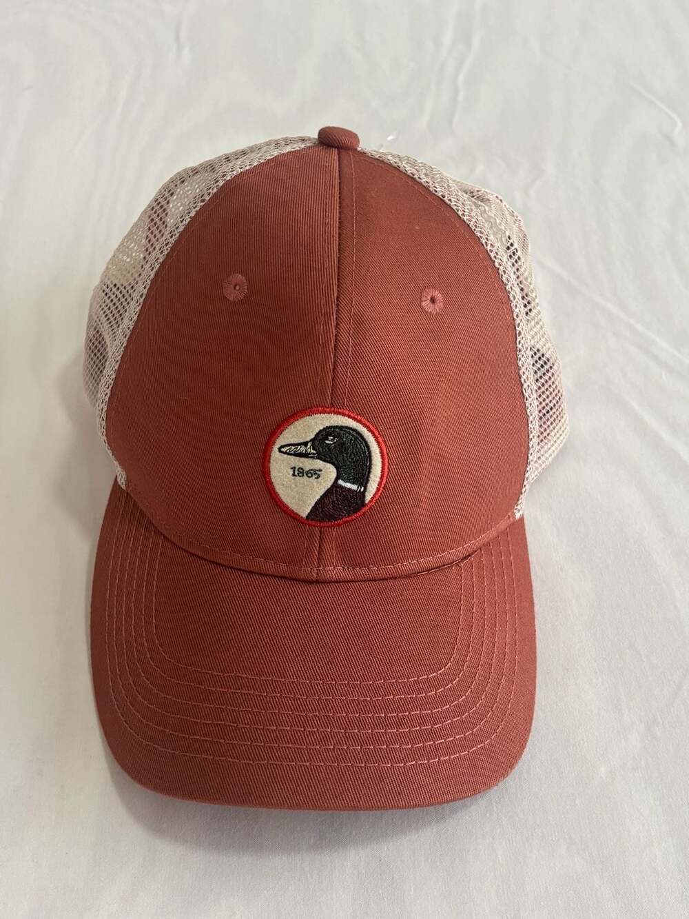 Duck Head Circle Patch Trucker Hat Apricot Brandy Tan